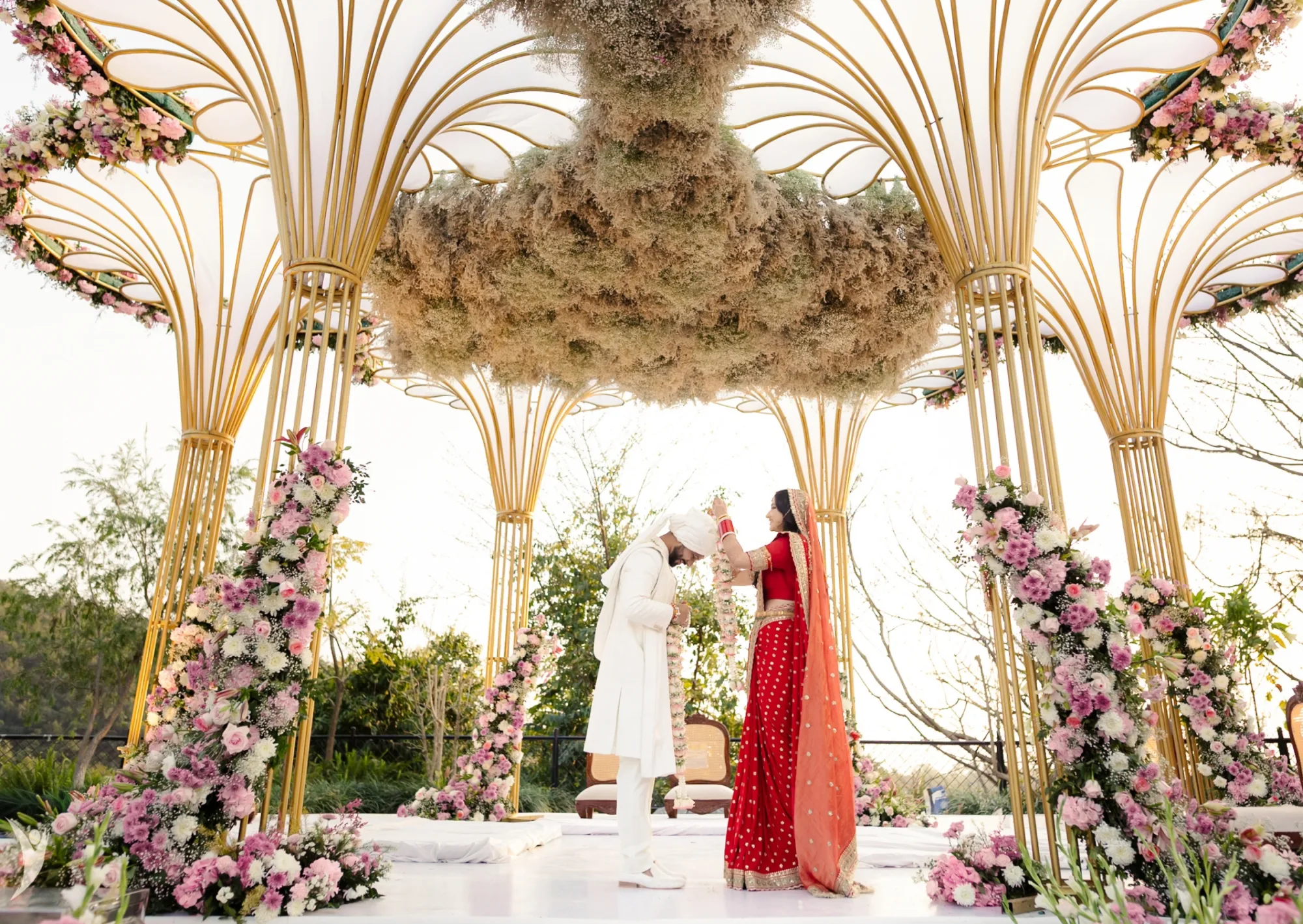 Varmala under a mandap — documentary and editorial wedding photography India